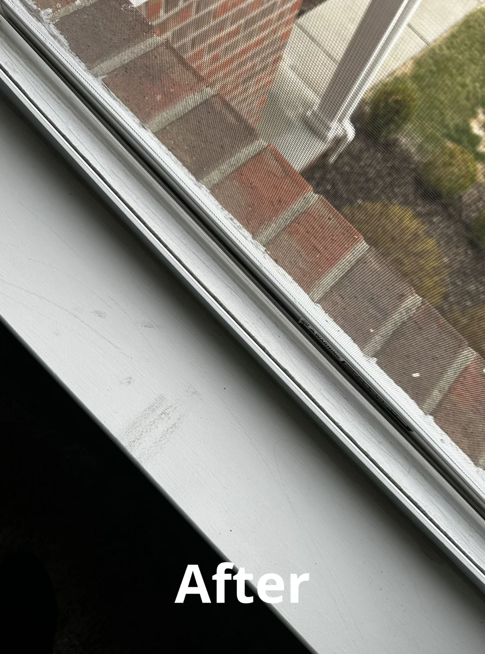 Clean white window frame and sill after pressure washing service